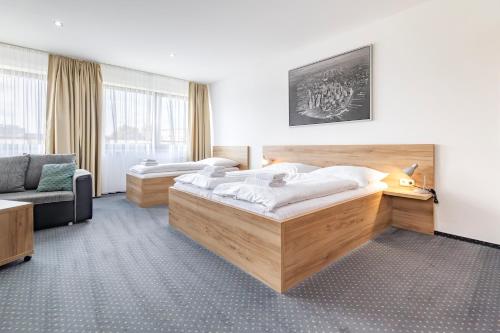 Posteľ alebo postele v izbe v ubytovaní Sport HOTEL Centrum