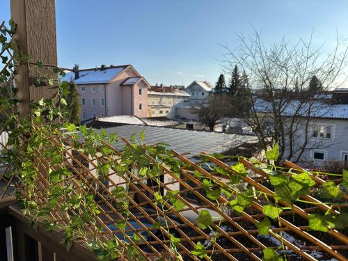 a view of a city from a balcony at Cozy City Apartment Penzberg in Penzberg