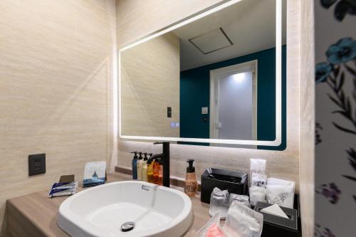a bathroom with a white sink and a mirror at HOTEL FARINA DOLCE (Adult Only) in Kanuma