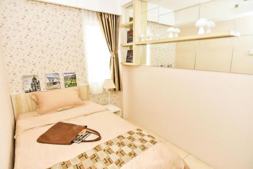 Кровать или кровати в номере Annora Living by RDK