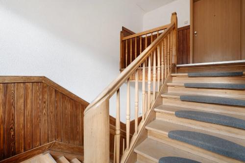 a staircase in a home with wood paneling at Waldliebe in Schramberg
