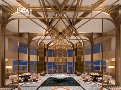 a rendering of a lobby with tables and chairs at Conrad Urumqi in Ürümqi