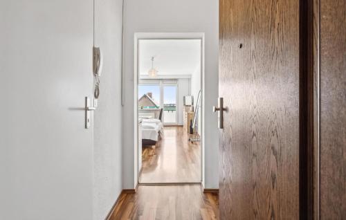 a hallway with a door leading to a bedroom with a bed at Stunning Apartment In Anklam in Anklam