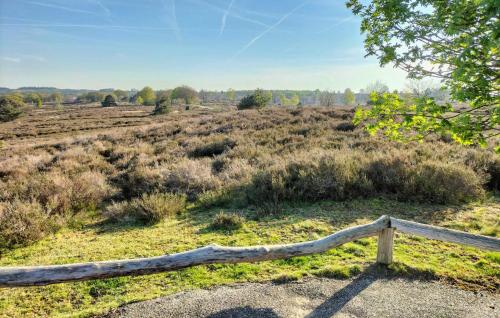 a wooden fence in the middle of a field at Beautiful Home In Hellendoorn With Wifi in Hellendoorn