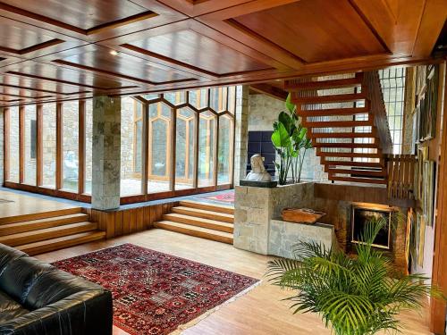 a living room with a couch and a fireplace at Casakubrick mansión in Castelltersol