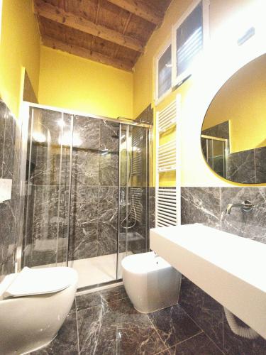a bathroom with a toilet and a sink and a shower at Crocetta Charme Apartment in Milan