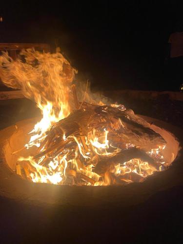 a bunch of fire in a pot with flames at Amboseli Amanya Lodge in Amboseli