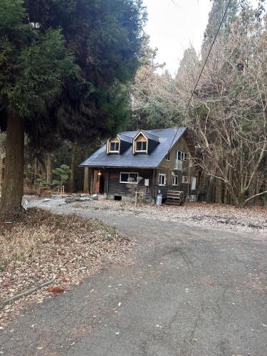 a house sitting on the side of a road at Rental villa Gontaya in Takamori