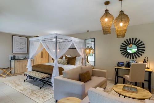 a bedroom with a bed and a living room at Pax Manor Muthaiga in Nairobi