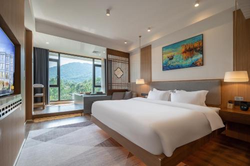 Postel nebo postele na pokoji v ubytování Z HOTEL- Qingchengshan