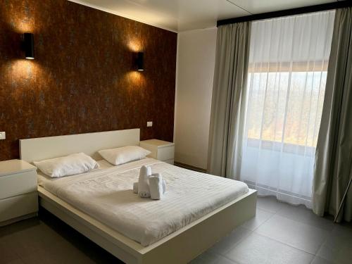 Postel nebo postele na pokoji v ubytování Rodizio Hill Resort