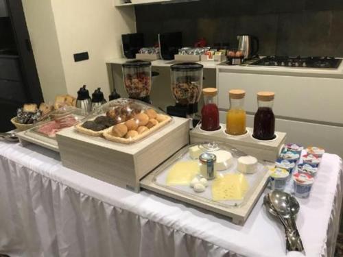 a table with a buffet of food on it at Ferienhaus Mit Wasserblick in Gesturi