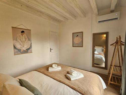 Postel nebo postele na pokoji v ubytování Gîte du Magnolia