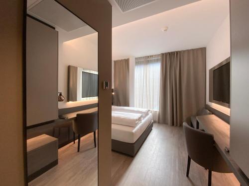 Postel nebo postele na pokoji v ubytování DION Hotel Wattens