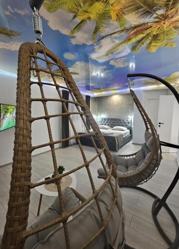 a room with a hammock and a bedroom at Cabana Ursu in Iaşi