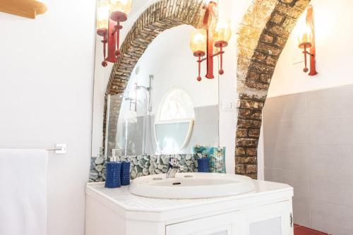 a bathroom with a sink and a mirror at Villa Daniela -Vista Mare-70metri dal Mare --Free Parking - WIFI in Terracina