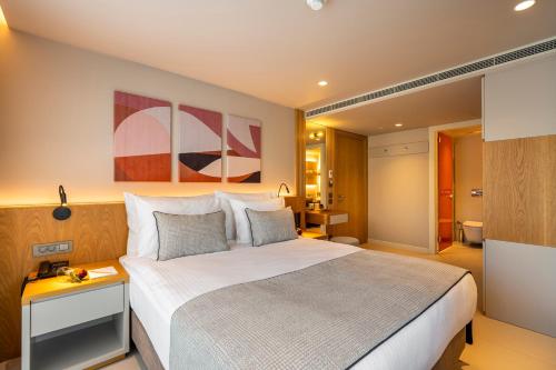 Postel nebo postele na pokoji v ubytování ERK Hotel