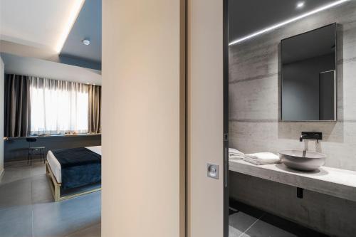 Postel nebo postele na pokoji v ubytování Catania Smart Hotel