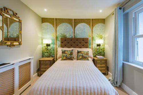 a bedroom with a large bed and a window at Regency Beach House by Bloom Stays in Walmer
