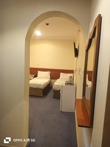 Postel nebo postele na pokoji v ubytování فندق نجمه اسيل