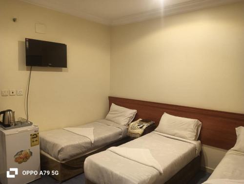 Postel nebo postele na pokoji v ubytování فندق نجمه اسيل