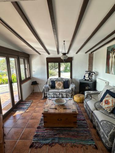 a living room with a couch and a coffee table at Villa Azafran in Málaga