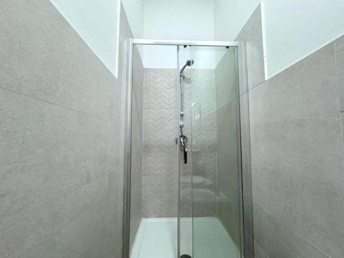 a shower with a glass door in a bathroom at Casa Ferrante in Cinisi