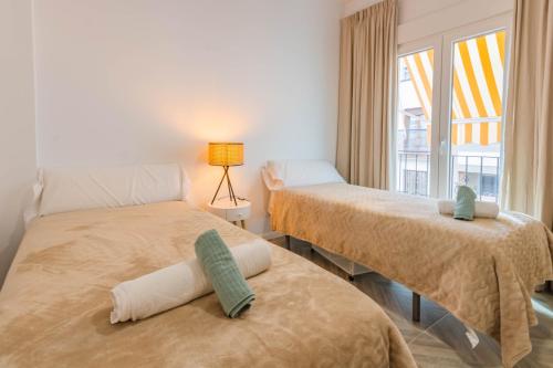 Postel nebo postele na pokoji v ubytování Luxury Downtown Station Córdoba