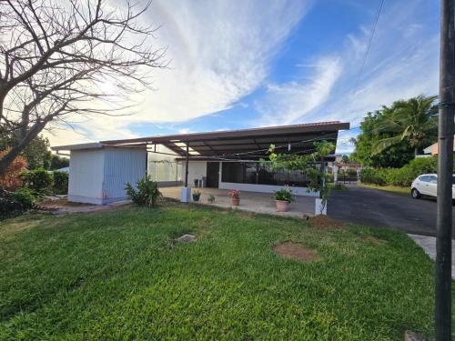 a gas station with a green lawn in front of it at Casa Rosabella in Ángeles