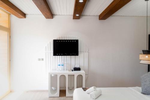 a living room with a tv on the wall at Hotel Dakhla Club & SPA in Dakhla