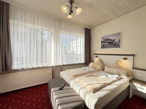 Postel nebo postele na pokoji v ubytování Hotel Weisse Düne