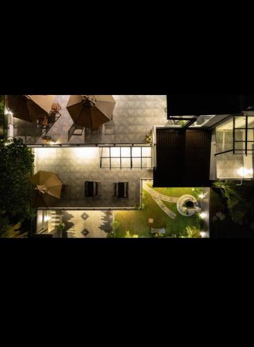 an overhead view of a building with umbrellas at Villa Mossa Ambalangoda Boutique villa in Ambalangoda
