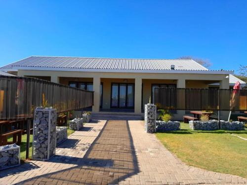 a house with a walkway in front of it at Mogale Royal Gardens in Polokwane
