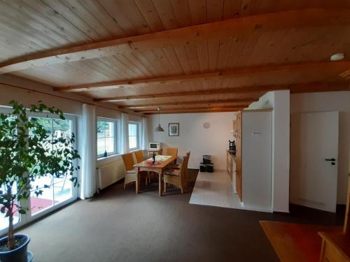 a living room with a table and a dining room at Fewo Stricker 31 in Walkenried