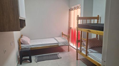 Ένα ή περισσότερα κρεβάτια σε δωμάτιο στο Hostel BELLA ARAÚJO ALFA