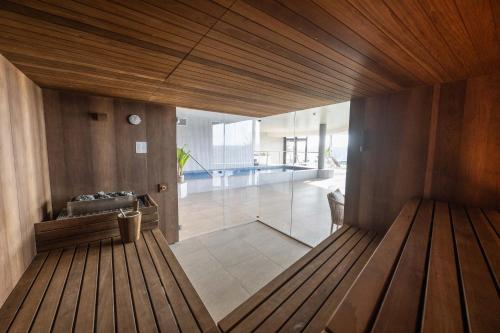 a bathroom with a tub and a sink in a room at Hotel du Bois d'Arlon in Arlon