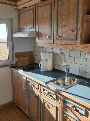 Una cocina o cocineta en Taun Hövt