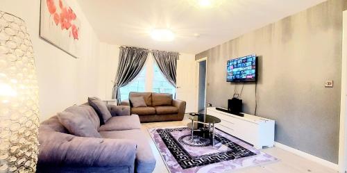 a living room with two couches and a tv at Sunderland Villa Luxuria 3 bedroom 3 Toilets Detached House in Sunderland