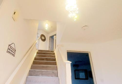 a staircase in a house with a stair case at Sunderland Villa Luxuria 3 bedroom 3 Toilets Detached House in Sunderland