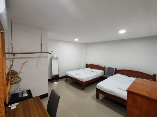 Ένα ή περισσότερα κρεβάτια σε δωμάτιο στο Lucena Apartments