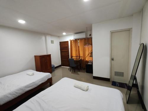 Postel nebo postele na pokoji v ubytování Lucena Apartments