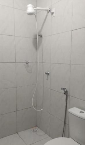 a bathroom with a shower with a glass door at Sítio Jacutinga 2025 in Pacoti