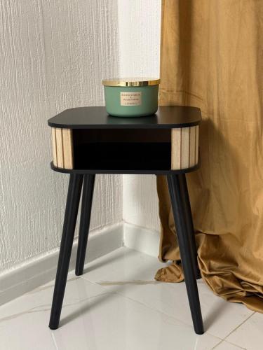 a black table with a bowl on top of it at A Casa di JO in Bari
