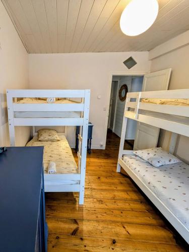 En eller flere senge i et værelse på Havre de paix