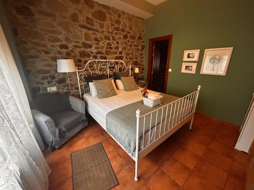 Ένα ή περισσότερα κρεβάτια σε δωμάτιο στο Hostal Casa San Nicolas