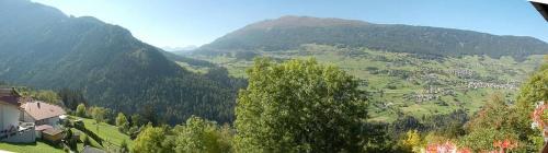a view of a valley with a village in the mountains at Haus Tauber in Jerzens
