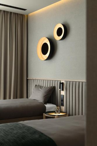 Ένα ή περισσότερα κρεβάτια σε δωμάτιο στο Hygge Hotel
