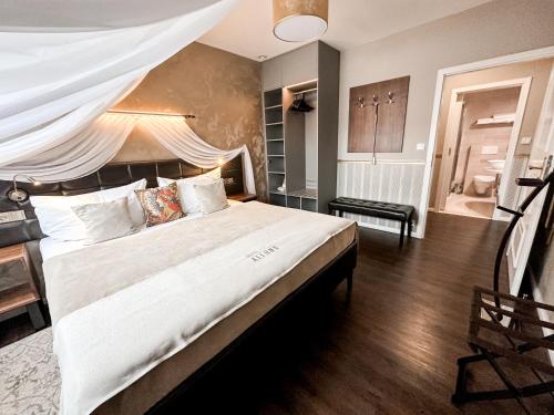 Alfons Boutique Hotelにあるベッド