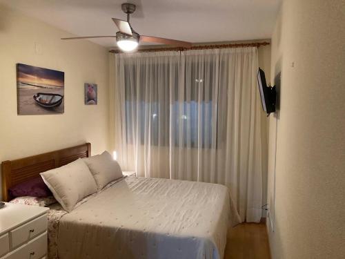 A bed or beds in a room at Águilas Playa