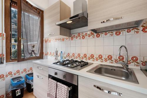 a kitchen with a sink and a stove at Casa Natalina in Recco
